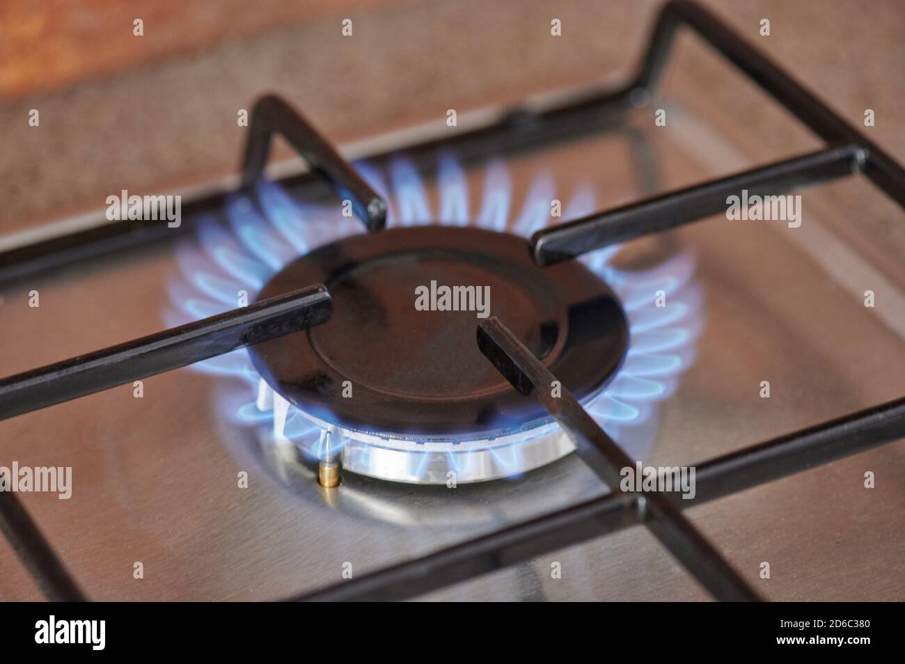 Modern kitchen stove with blue flame close up view Stock Photo - Alamy