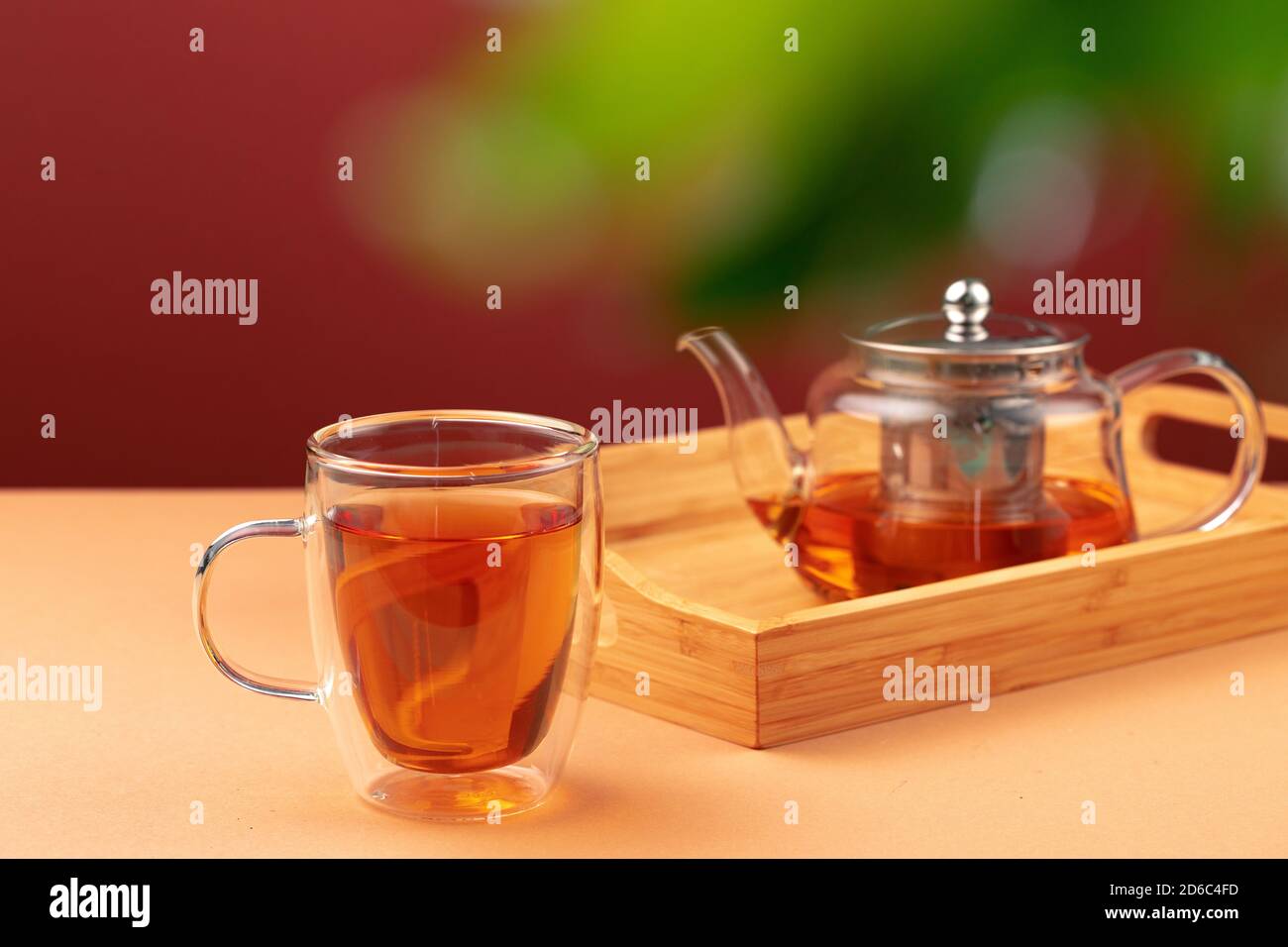 Glass teapot and cup with black tea Stock Photo - Alamy