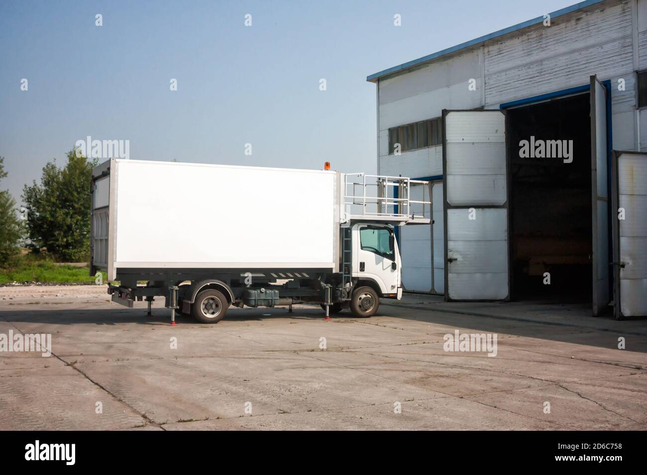Airport catering truck near garage boxes Stock Photo