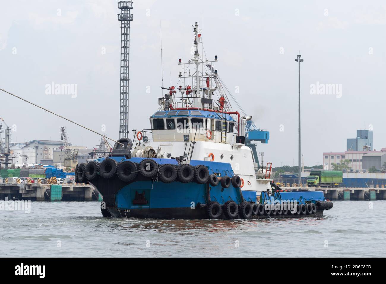 Blue Single Tugboat in Asian Port Stock Photo