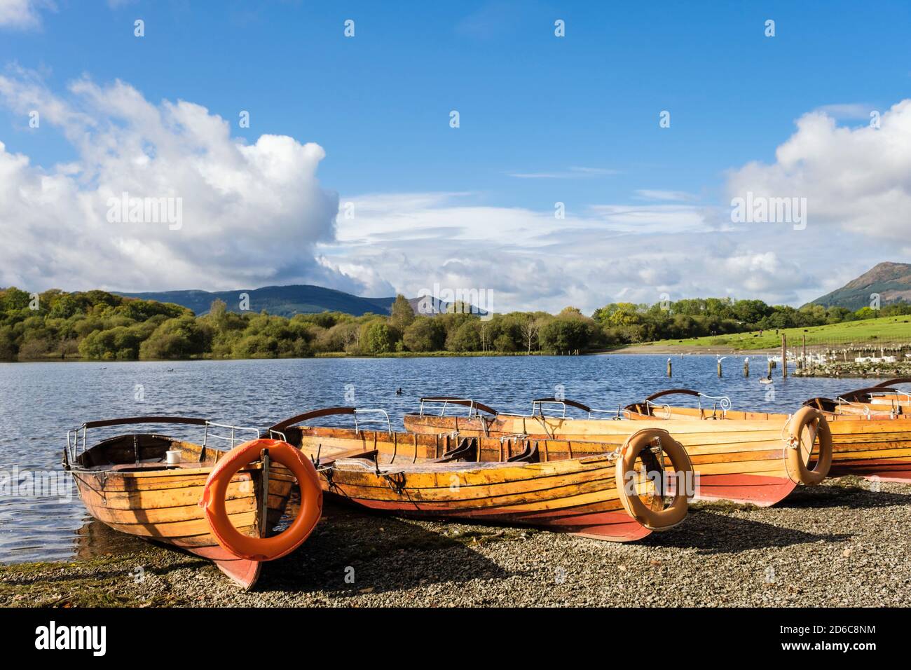 Rowing boats on Derwentwater shore in northern Lake District National Park in autumn. Keswick, Borrowdale, Cumbria, England, UK, Britain Stock Photo