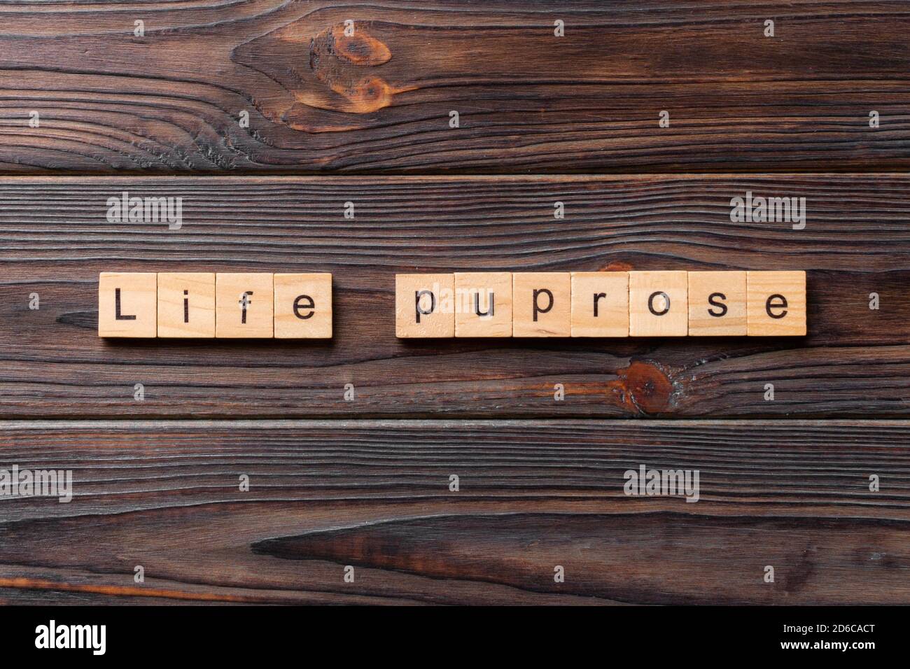 life purpose word written on wood block. life purpose text on cement table for your desing, concept. Stock Photo