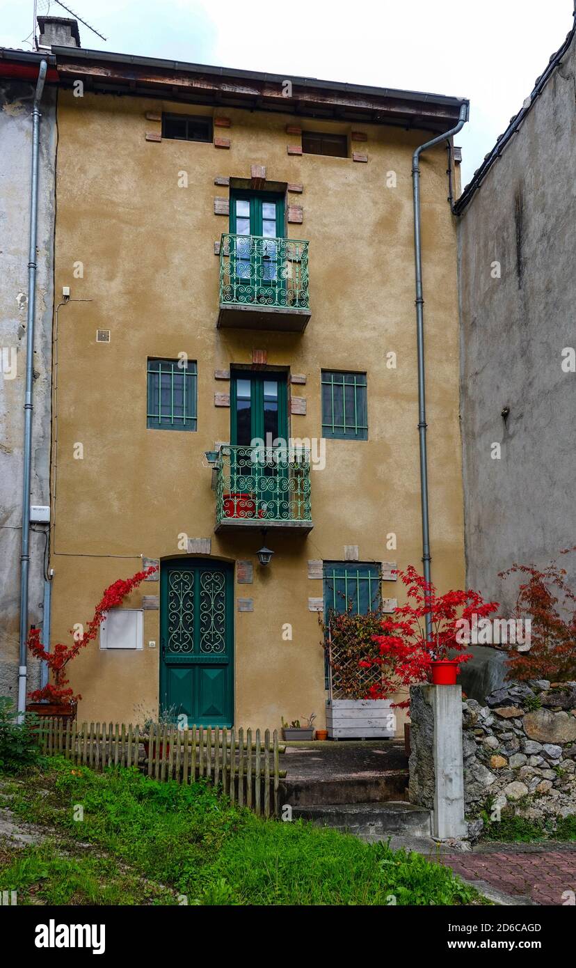Tall thin old house in the village of Rabat les Tres Seigneurs, Ariege, French Pyrenees, France, Pyrenees mountains in autumn Stock Photo