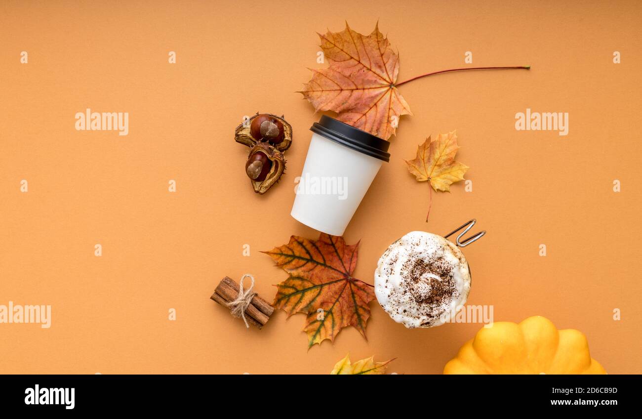 Cozy autumn style flat lay of hot pumpkin spice latte with whipped milk ...