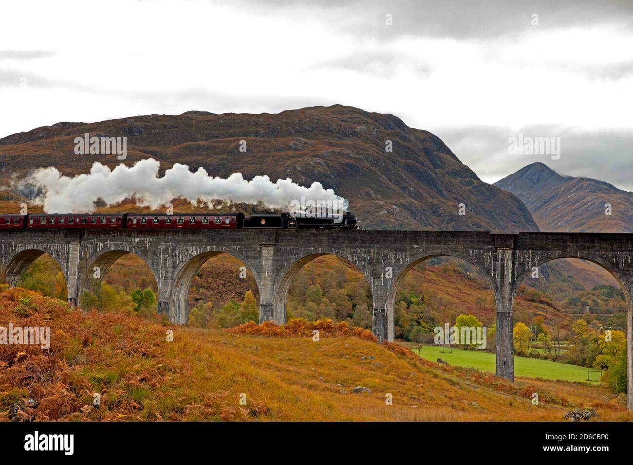 Glenfinnan, Lochaber, Scotland, UK. 16 October 2020. Visitors still flocking to view the Jacobite Steam Train on a cloudy autumn day at the Glenfinnan Viaduct. Construction for a new much needed car park is underway.Credit Scottishcreative/Alamy Live News. Stock Photo