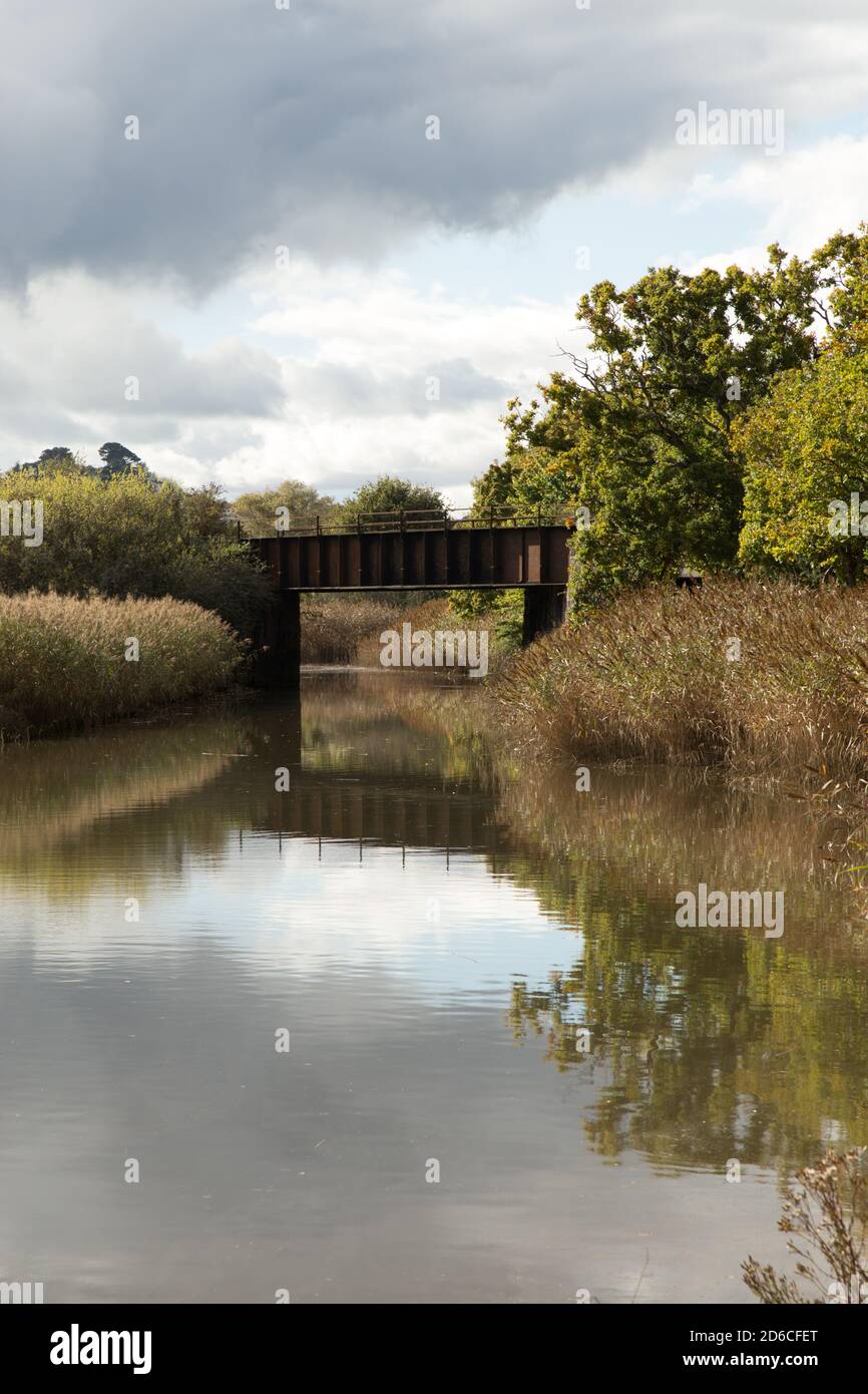 Reflection of Railway bridge over the river at Hackney Marsh Nature Reserve Kingsteignton Stock Photo