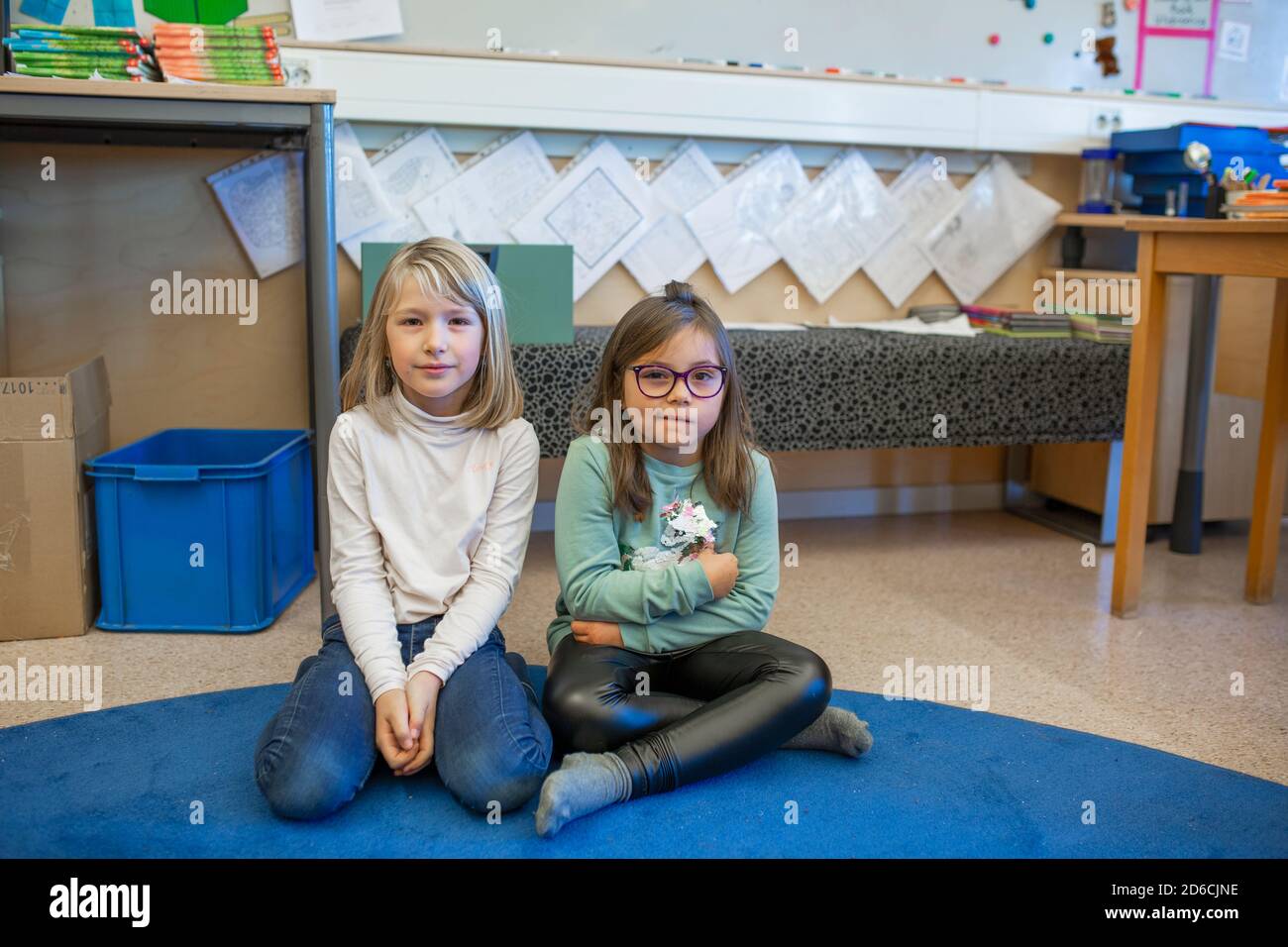 Girls sitting in classroom Stock Photo - Alamy