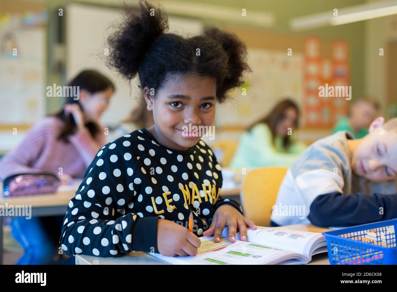 Girl in classroom Stock Photo - Alamy