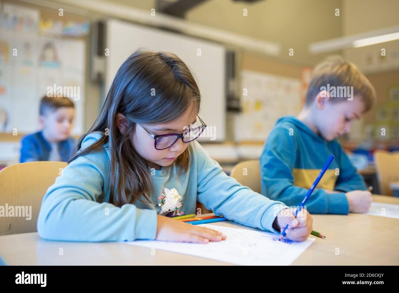 Girl in classroom Stock Photo - Alamy