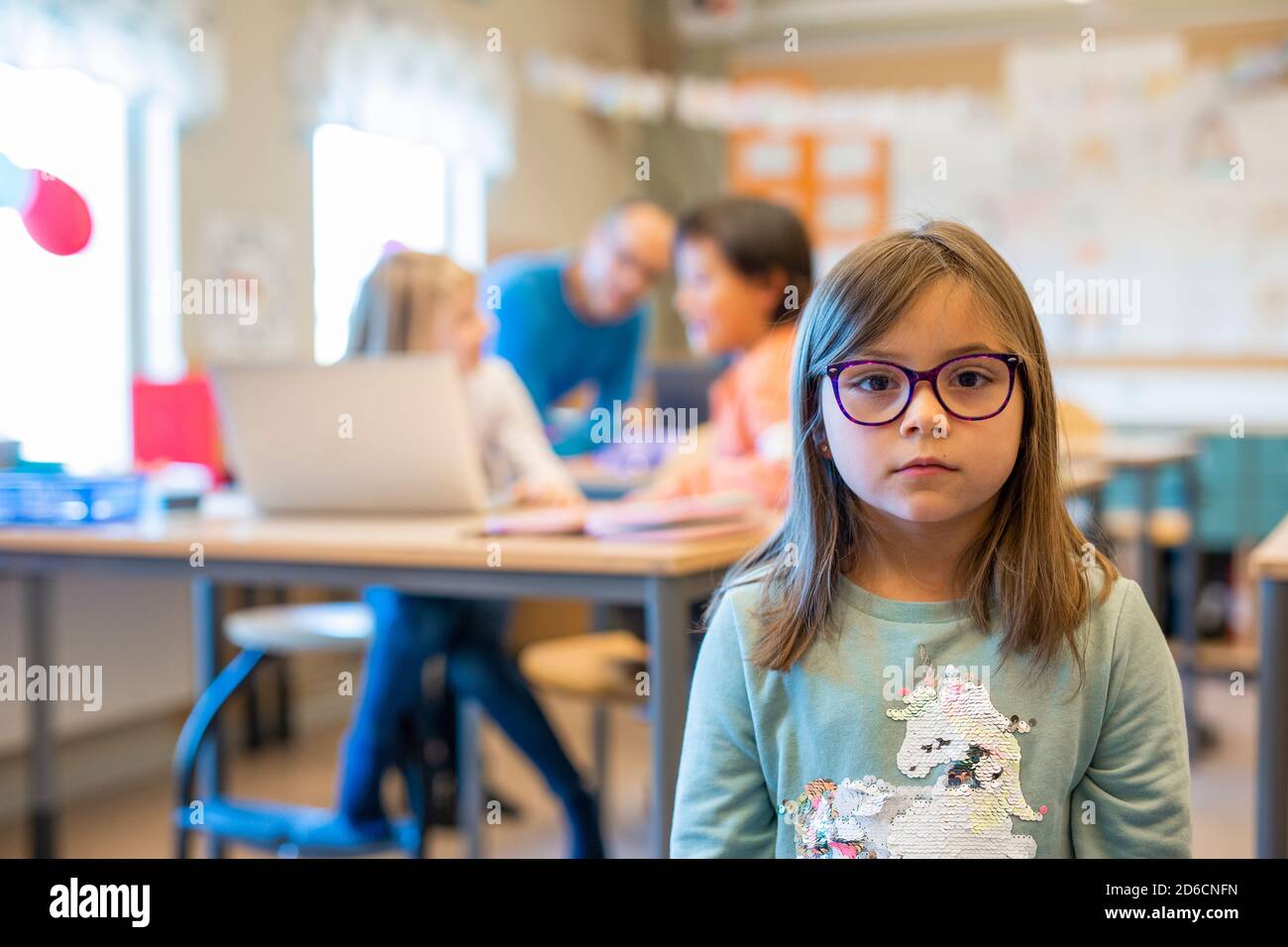 Girl in classroom Stock Photo - Alamy