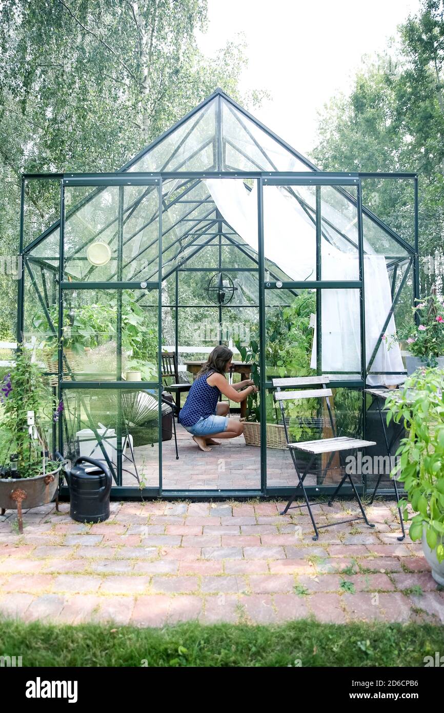 Greenhouse garden woman 40 hi-res stock photography and images - Alamy