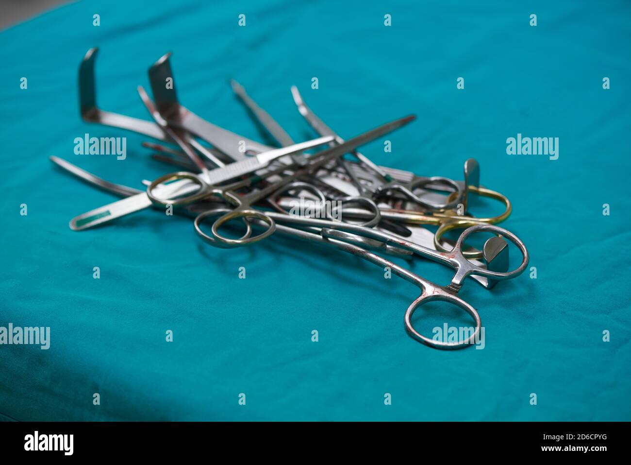 Surgical instruments after use on operating table. Hemostat, retractor