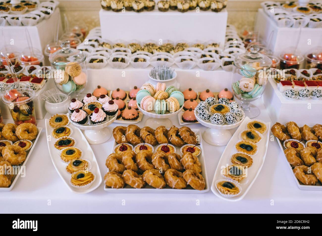 Various colored delicious sweets in a candy bar at a wedding. Sweet table. Wedding  buffet Stock Photo - Alamy, image size:1300x955