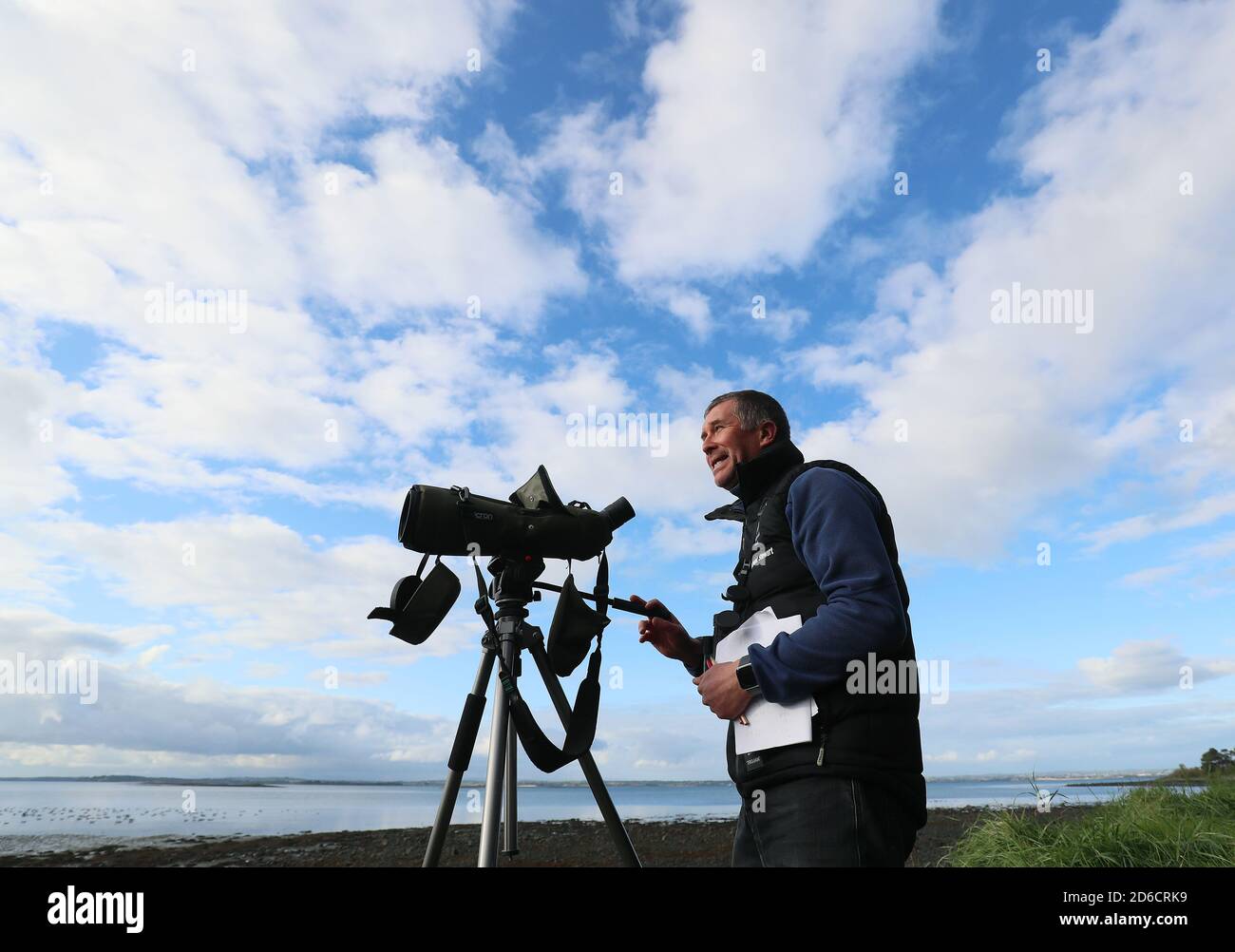 Andrew Upton, National Trust countryside manager for East Down, on the shores of Strangford Lough in Newtownards, Northern Ireland, as the National Trust undertake their annual count of the Canadian Brent Geese population. Between 20,000 to 30,000 geese arrive on the lough each year having journeyed from Canada. Stock Photo