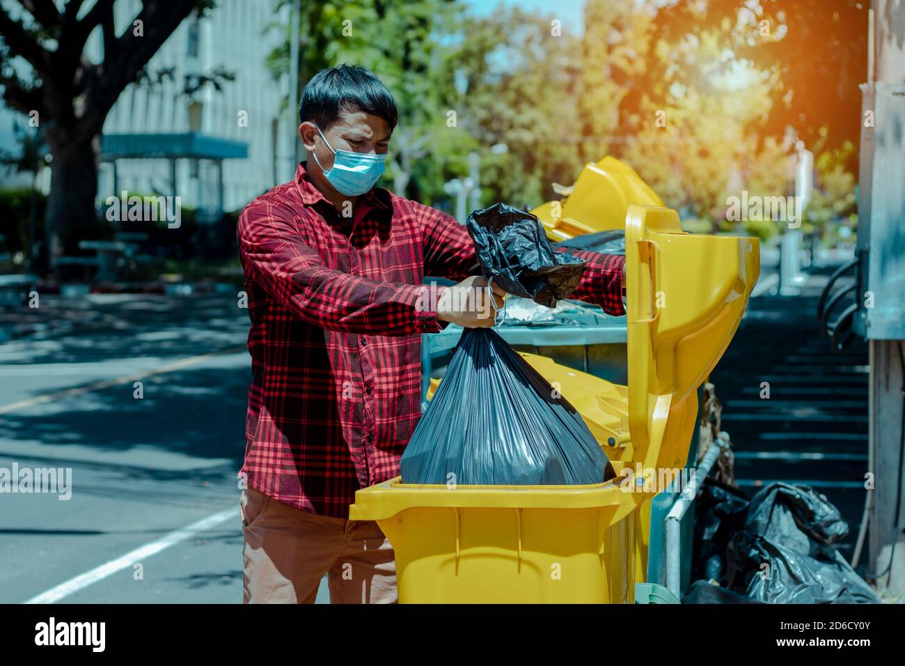 The man took the black bag to throw away the garbage Stock Photo Alamy