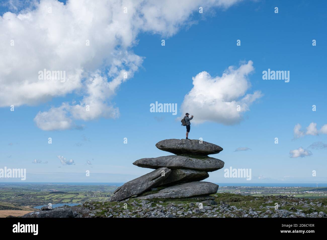 Showery Tor, Bodmin, Cornwall, UK. UK Weather.  A walker takes selfies on the top of Showery Tor on Bodmin Moor. Credit Simon Maycock / Alamy Live News. Stock Photo