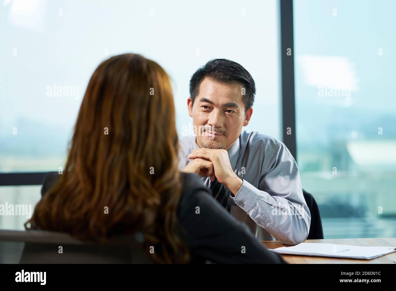asian hr manager interviewing a female job candidate in office Stock Photo