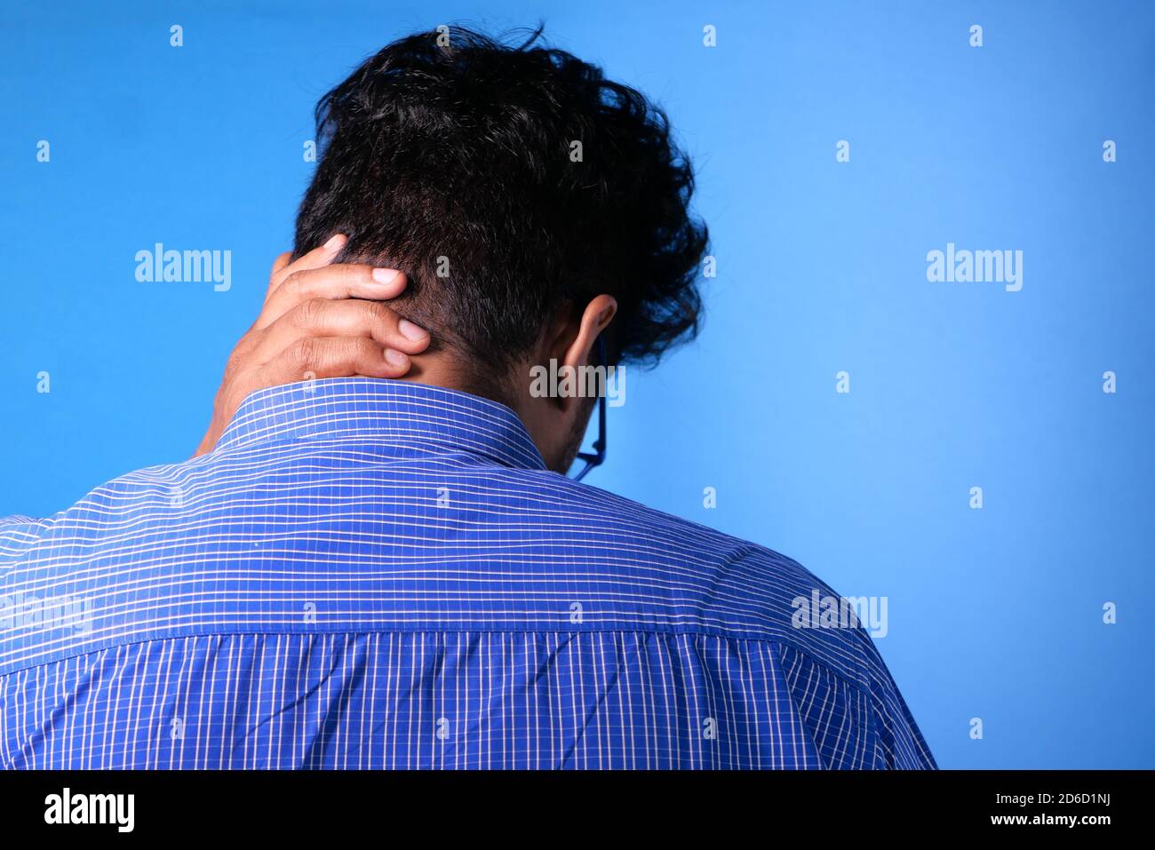 man suffering from neck or shoulder pain at home Stock Photo - Alamy