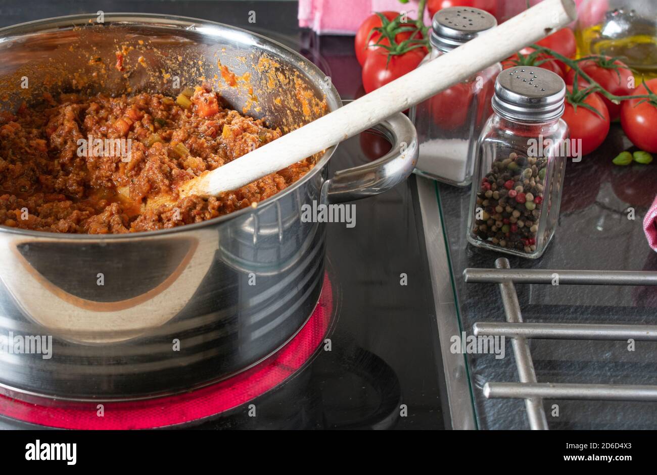 Bolognese Sauce simmering on the hob / stove Stock Photo