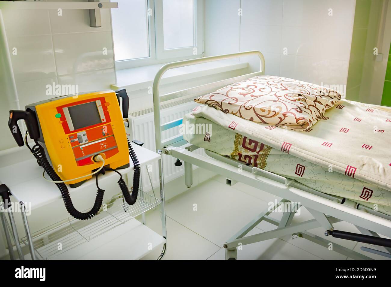 Background of new yellow defibrillator in hospital ward for health