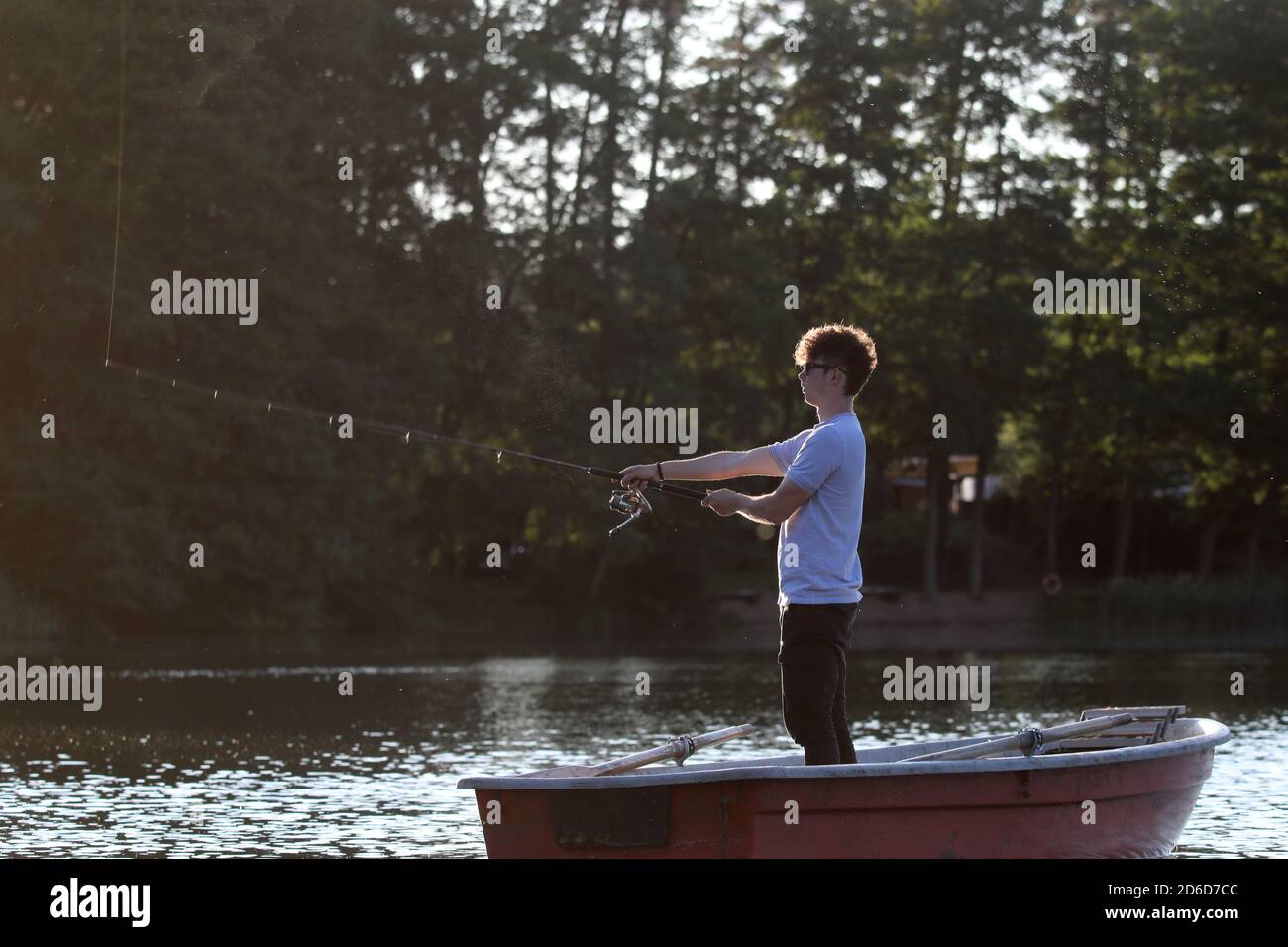Adolescent fishing hi-res stock photography and images - Alamy