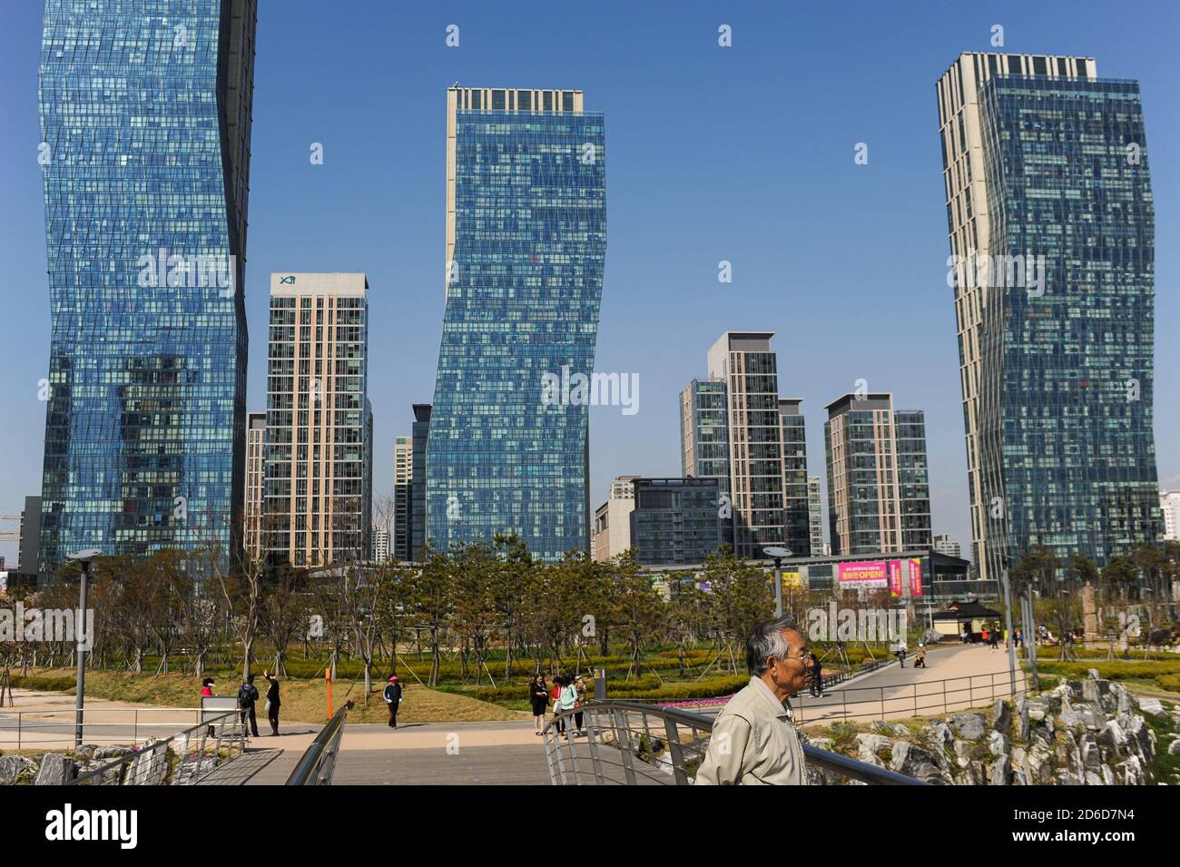 01.05.2013, Seoul, Incheon, South Korea - People in front of the New Songdo City in Central Park and the international business district with modern r Stock Photo