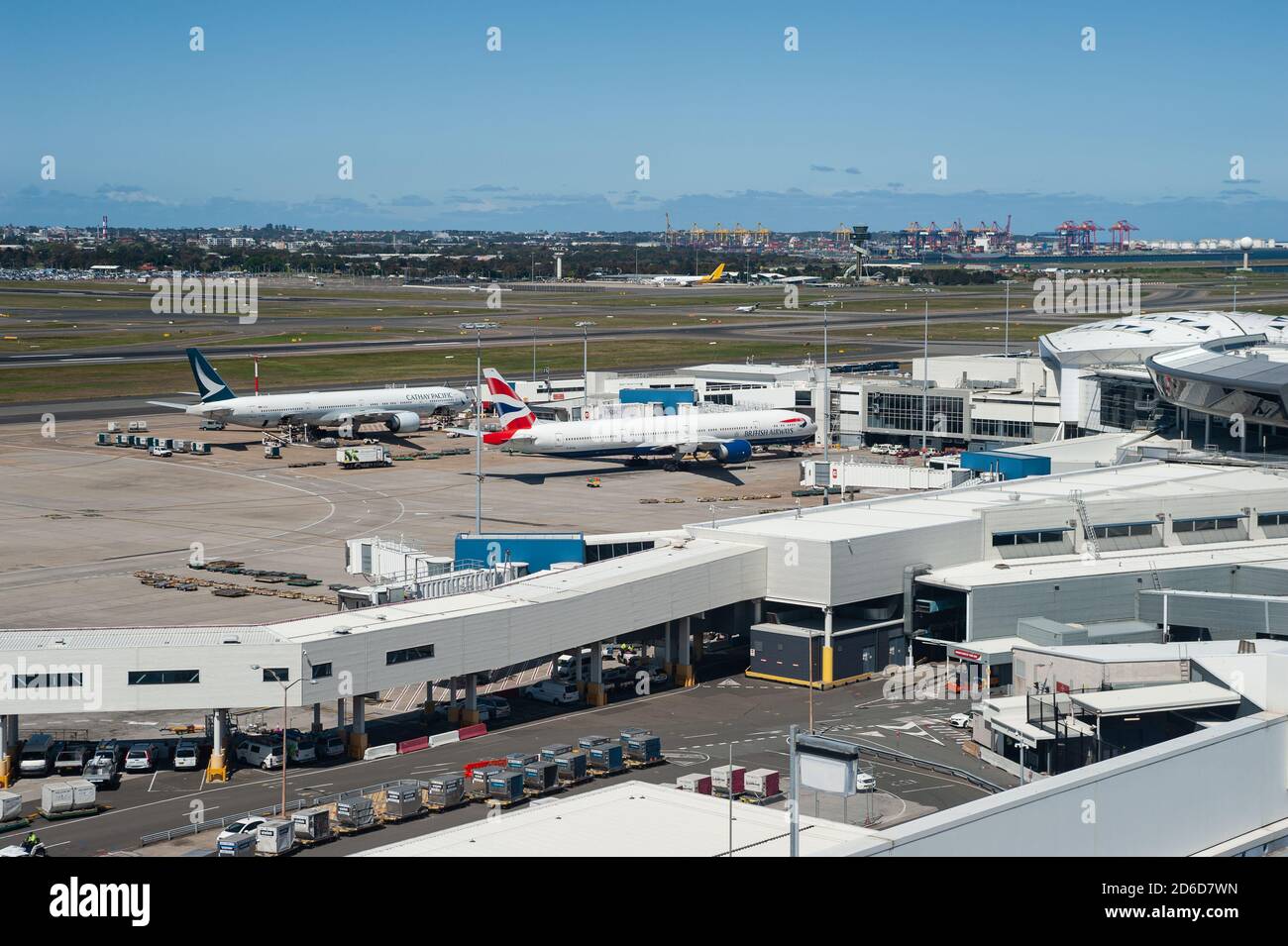 28.09.2019, Sydney, New South Wales, Australia - Two passenger planes of British Airways and Cathay Pacific park at their gate at Kingsford Smith Inte Stock Photo