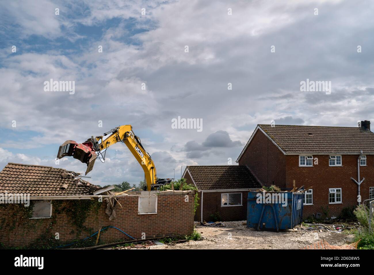 Heavy machinery demolishes private house to make way for development of new Lidl supermarket along Minster Way in Beverley, Yorkshire, UK. Stock Photo