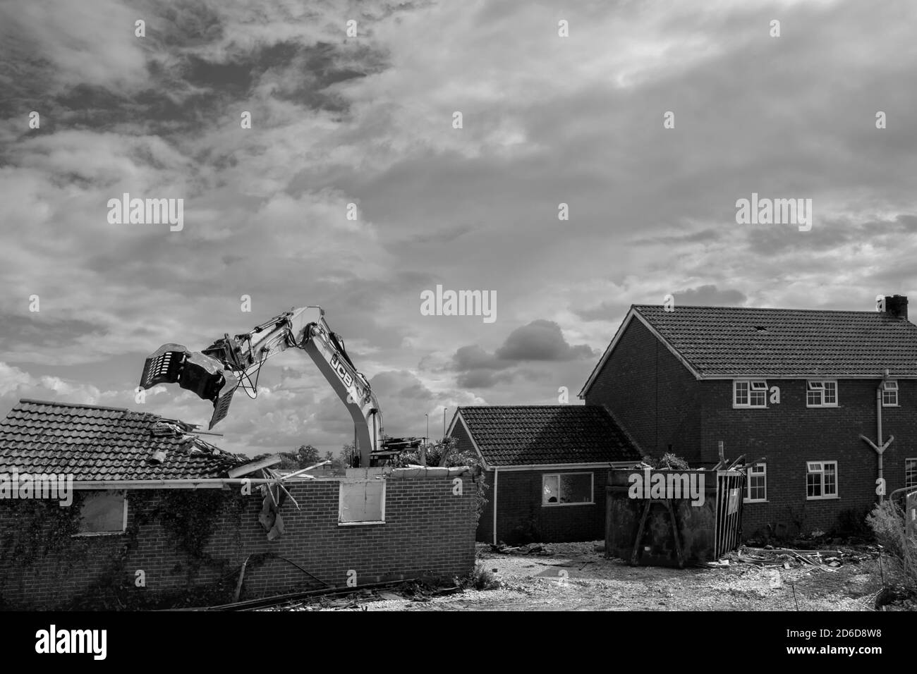 Heavy machinery demolishes private house to make way for development of new Lidl supermarket along Minster Way in Beverley, Yorkshire, UK. Stock Photo