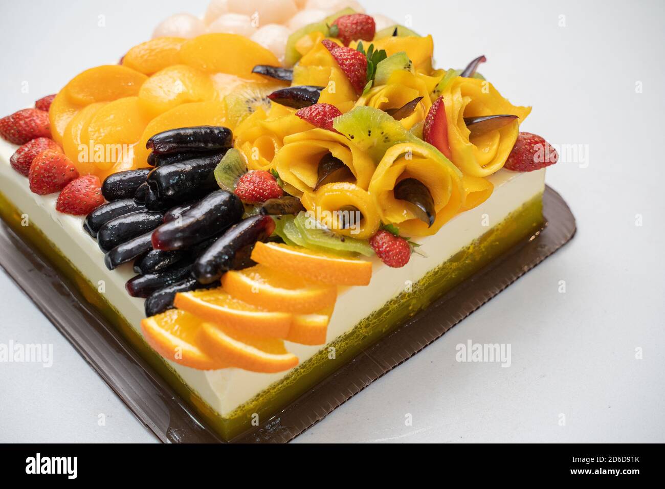 Beautiful Fruit Pudding With Strawberries Mango Oranges And Grapes Served On A White Table Stock Photo Alamy