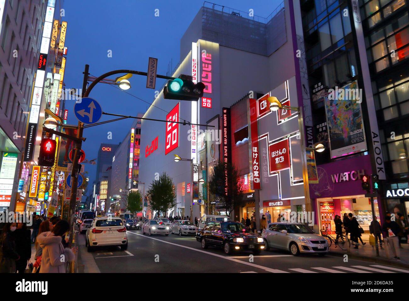 TOKYO, JAPAN - NOVEMBER 30, 2016: People walk under the neon lights of  Shinjuku district of Tokyo, Japan. Tokyo is the capital city of Japan.   mil Stock Photo - Alamy