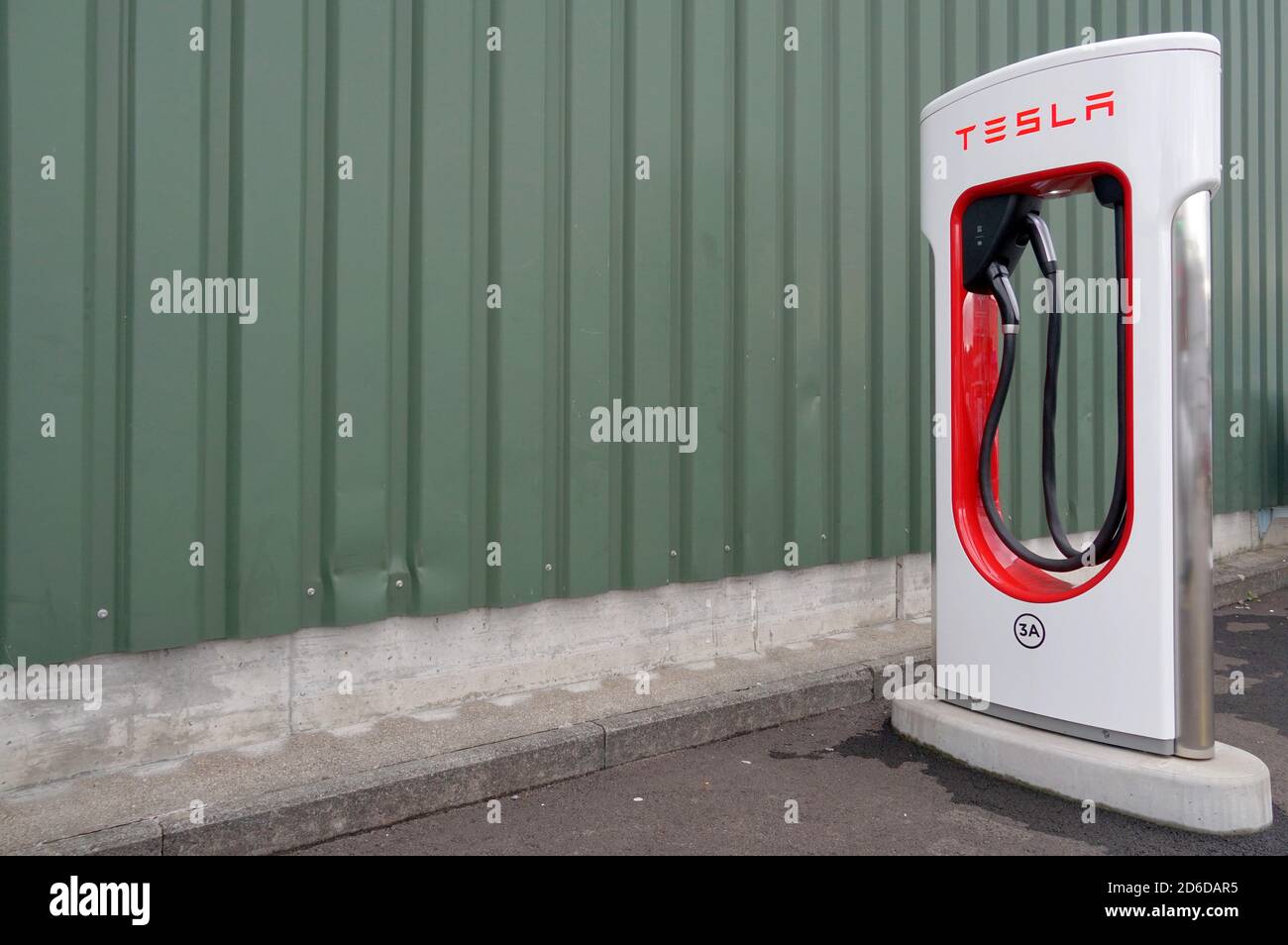 Tesla electric charging station in lateral view located in an industrial district near Zurich with a lot of copy space. Stock Photo