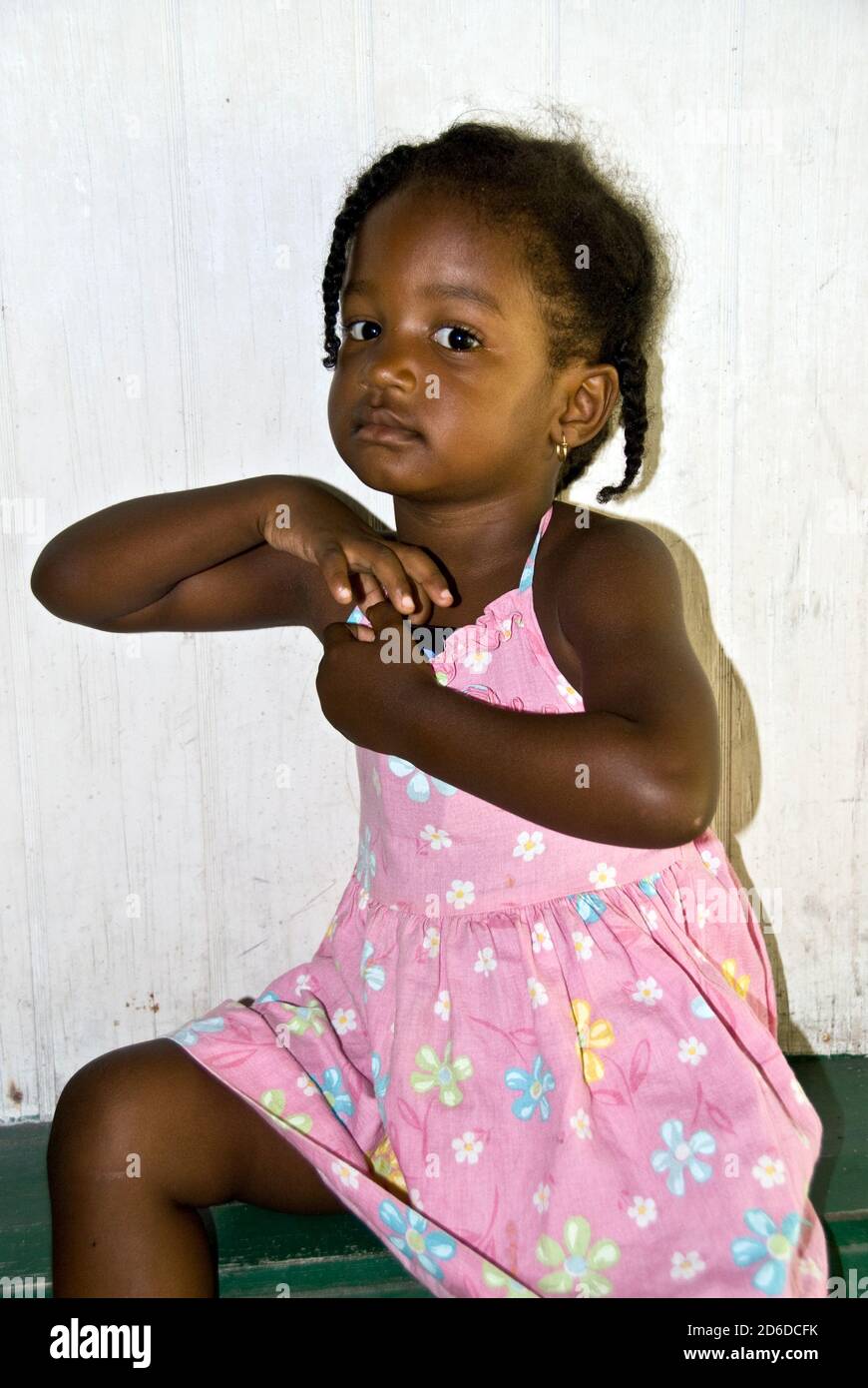 Young black girl in pink dress on Isla de Providencia, Columbia Stock Photo  - Alamy
