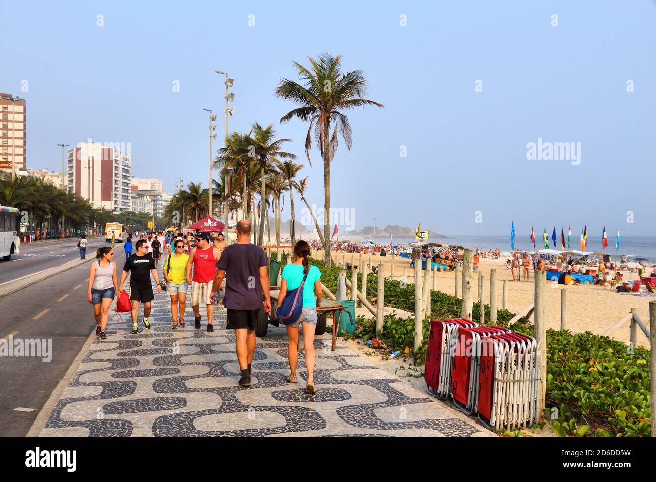 RIO DE JANEIRO, BRAZIL - OCTOBER 18, 2014: People visit Ipanema beachfront walk in Rio de Janeiro. In 2013 1.6 million international tourists visited Stock Photo