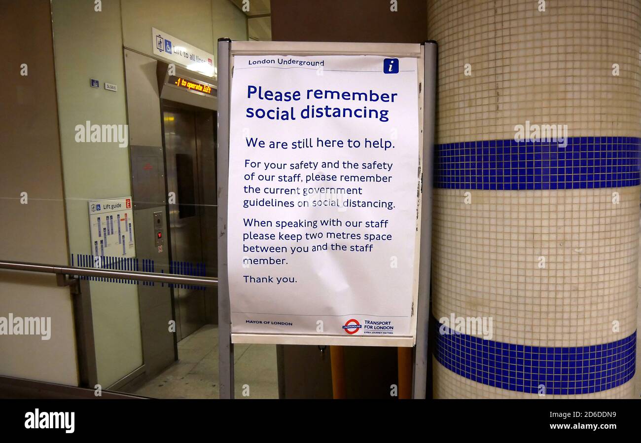 A sign about social distancing is displayed at St Pancras tube station the day after Prime Minister Boris Johnson ordered pubs, restaurants, leisure c Stock Photo