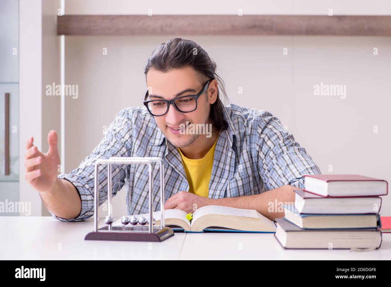 Male student preparing for exam at home Stock Photo