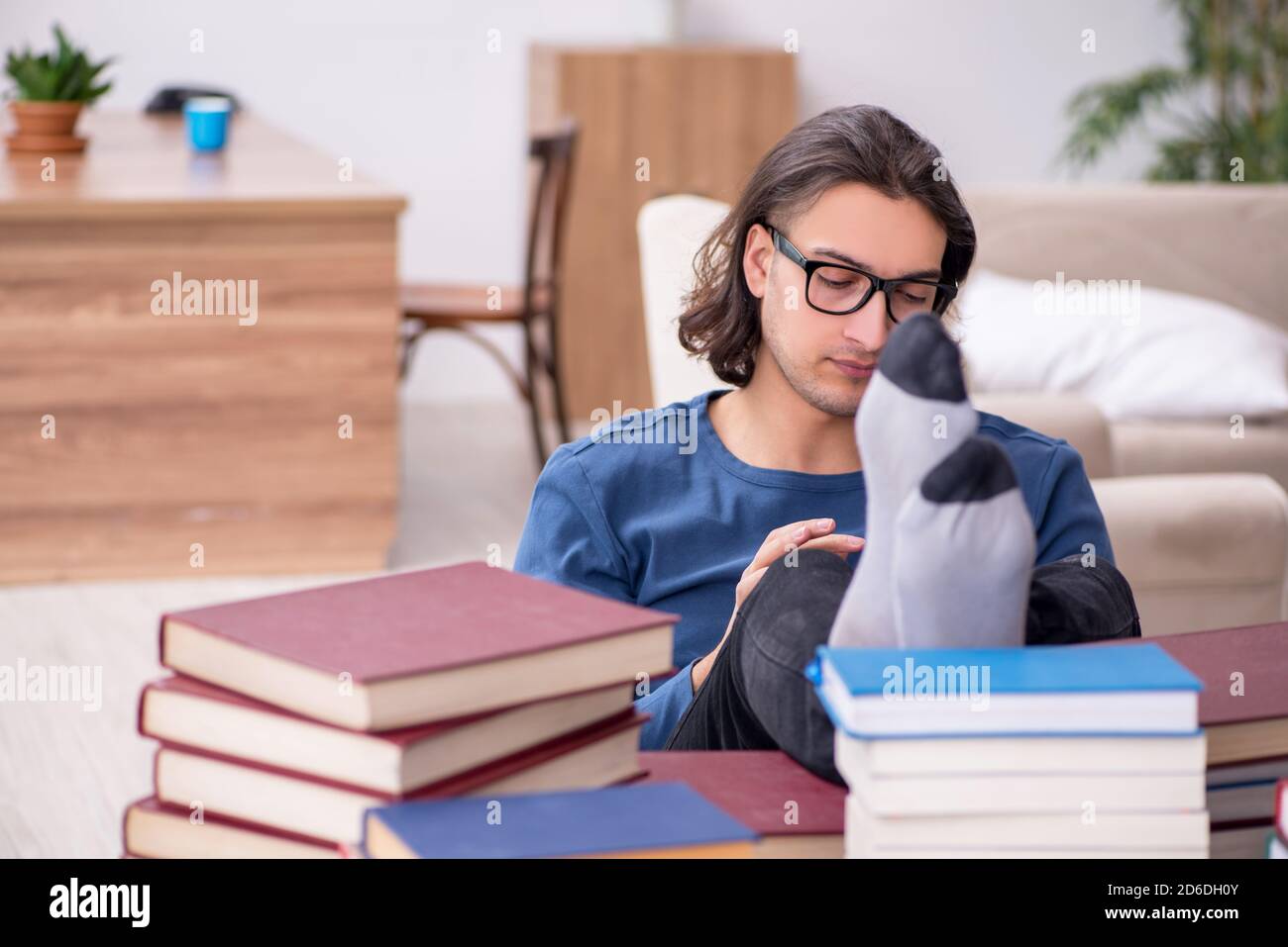 Young student preparing for exams at home Stock Photo - Alamy