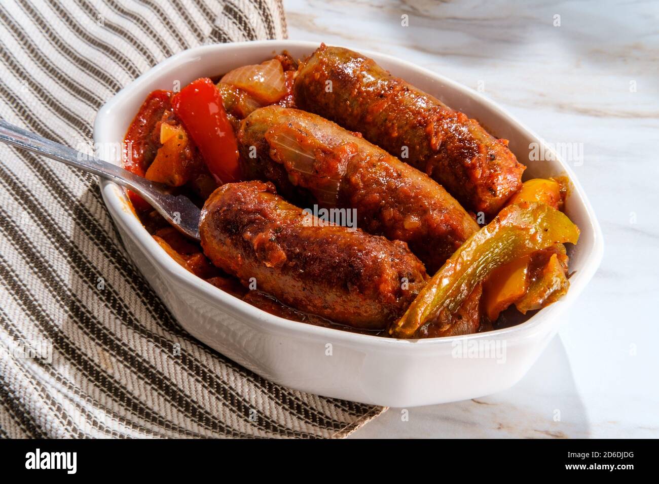 Onepot Italian sausage onions and peppers with potatoes in spicy