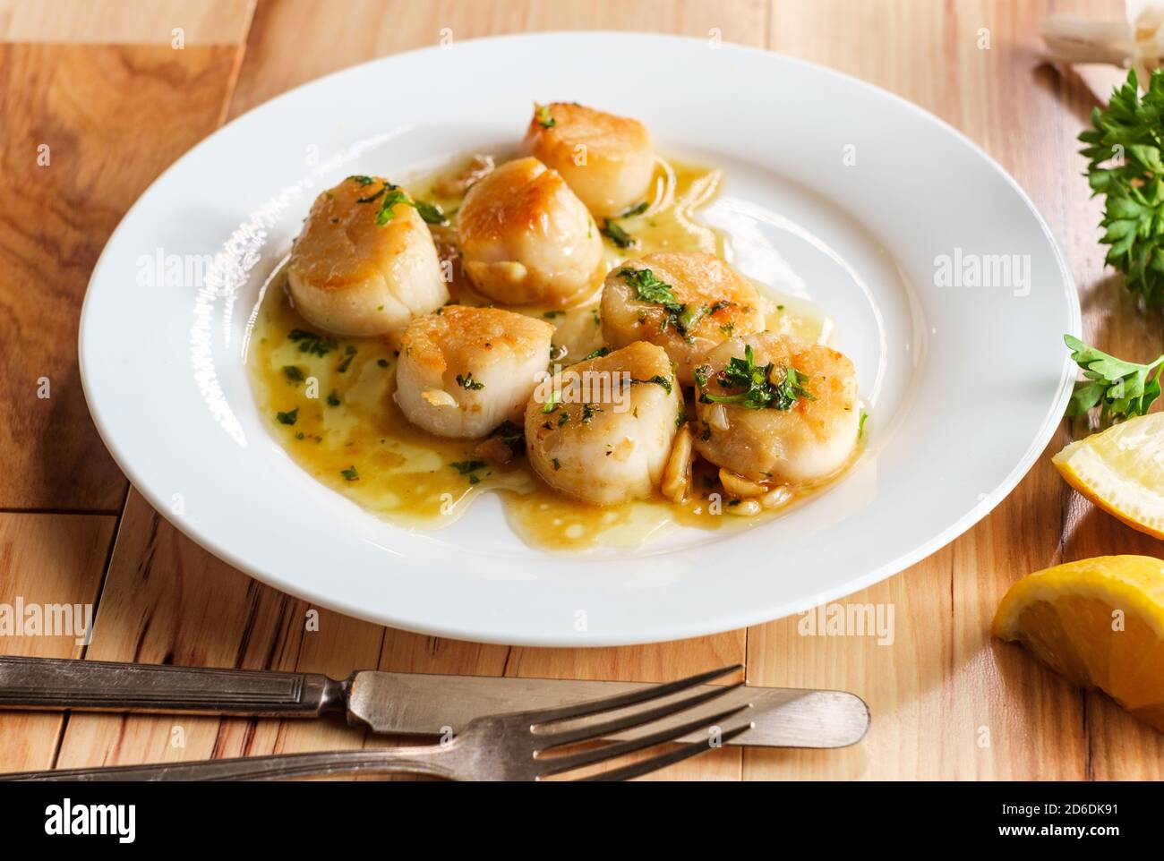 Seared Portuguese scallops in a white white wine lemon garlic sauce
