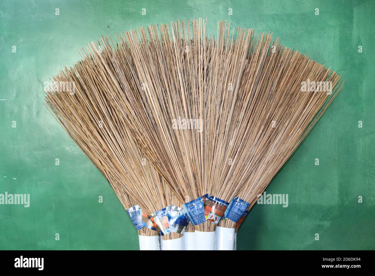 A bundle of handmade brooms which are made by coconut sticks. These are