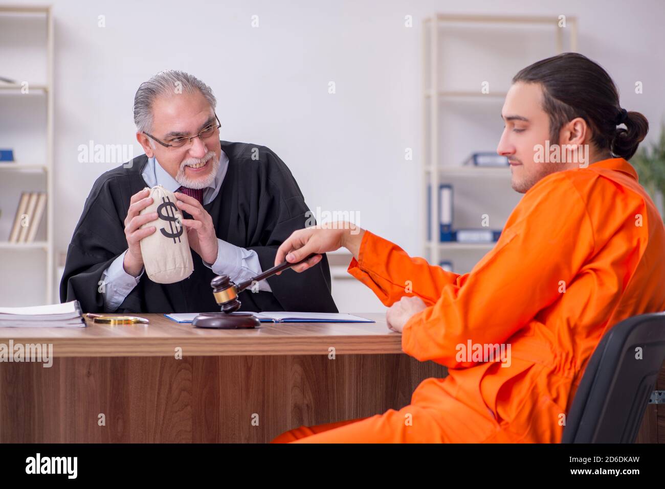 Old judge meeting with young captive in courthouse Stock Photo Alamy