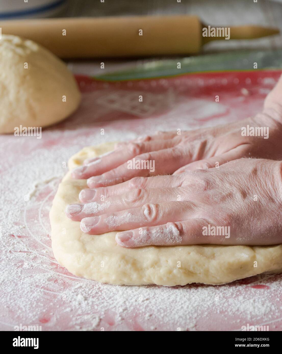 Woman's hands kneading dough at home Stock Photo - Alamy