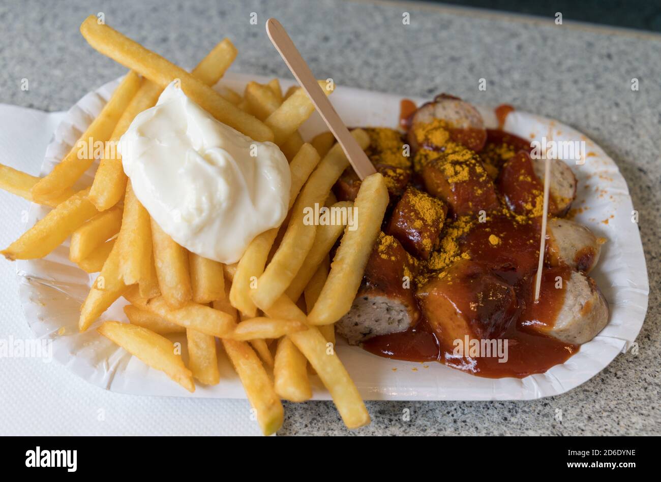 German junk food of Currywurst and fries with mayo Stock Photo
