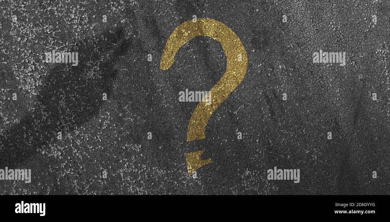 A question mark on a wall background. The shadow of a female hand. Dark ...