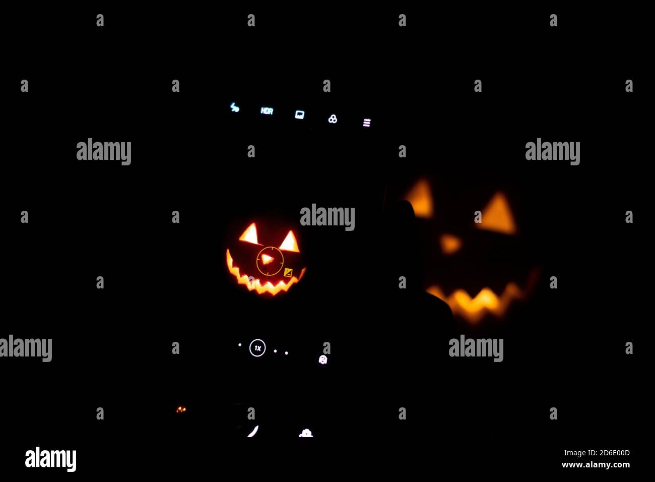 Halloween pumpkin in the dark with lighted candle inside. horror theme ...