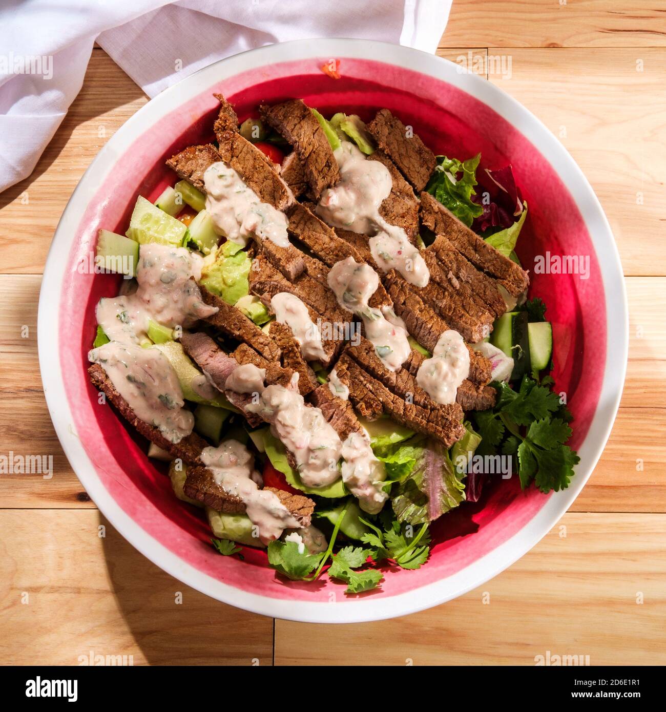 Large Mexican steak salad bowl with romaine lettuce and creamy chipotle