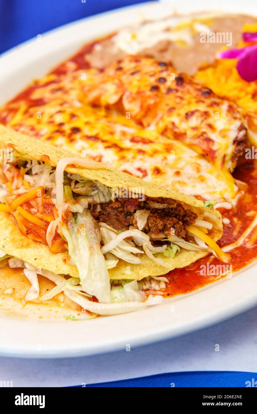 Authentic Mexican tamale cheese enchilada and beef taco dinner with