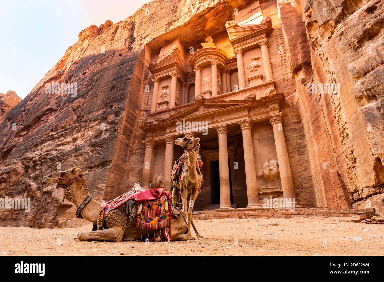 Stunning view of two camels posing in front of the Al Khazneh (The Treasury) in Petra. Al-Khazneh is one of the most elaborate temples in Petra. Stock Photo