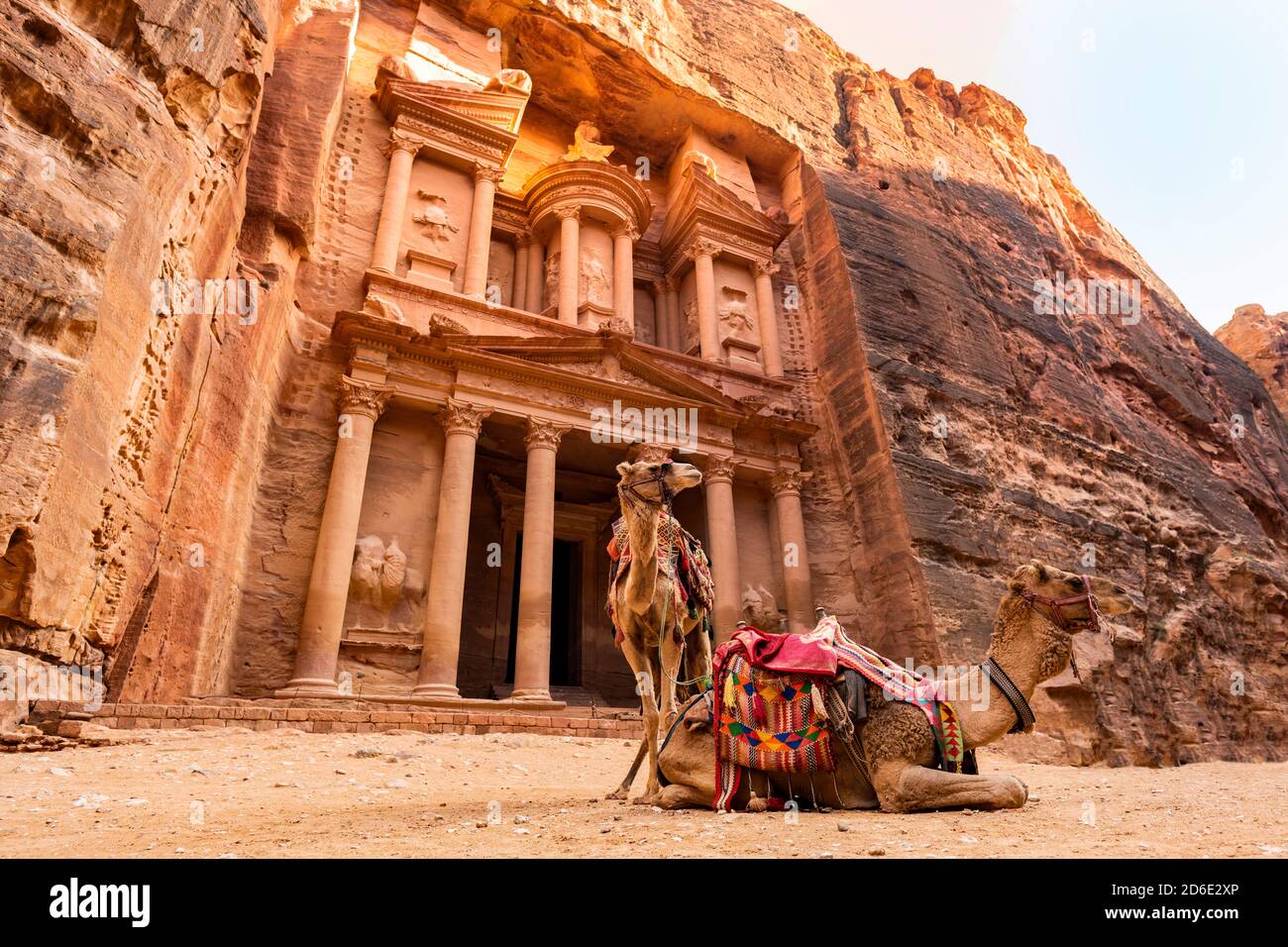 Stunning view of two camels posing in front of the Al Khazneh (The Treasury) in Petra. Al-Khazneh is one of the most elaborate temples in Petra. Stock Photo