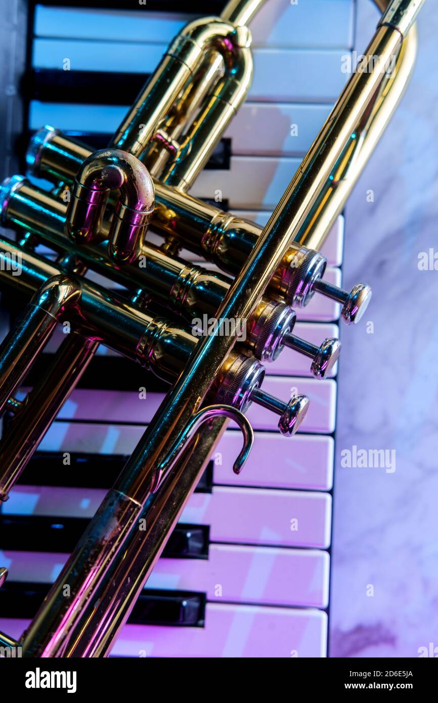 Old and worn Jazz trumpet and piano keyboard musical show and